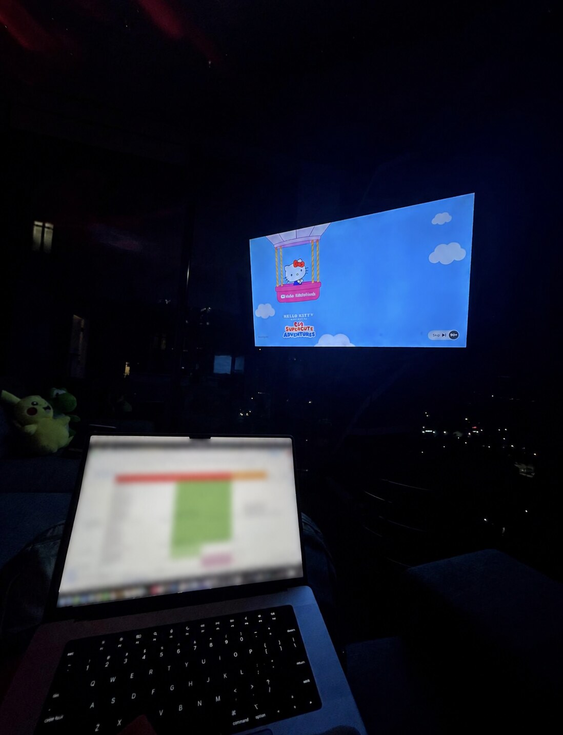 A private late-night work session with the laptop screen blurred